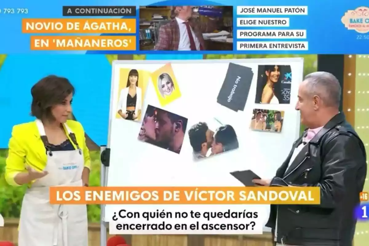 Adela González y Victor Sandoval están de pie frente a un tablero con varias fotos y tarjetas en Mañaneros. La mujer lleva un delantal blanco y una chaqueta amarilla, mientras que el hombre viste una chaqueta de cuero negra. En la parte superior de la imagen hay texto sobre un programa de televisión, y en la parte inferior se lee una pregunta sobre con quién no te quedarías encerrado en un ascensor. Adela González y Victor Sandoval están de pie frente a un tablero con varias fotos y tarjetas en Mañaneros. La mujer lleva un delantal blanco y una chaqueta amarilla, mientras que el hombre viste una chaqueta de cuero negra. En la parte superior de la imagen hay texto sobre un programa de televisión, y en la parte inferior se lee una pregunta sobre con quién no te quedarías encerrado en un ascensor.