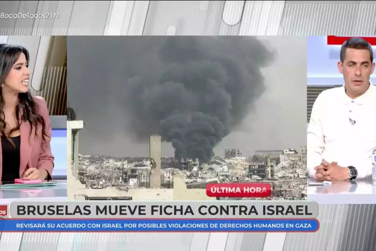 Sarah Santaolalla y Antonio Naranjo discuten sobre una noticia de última hora que muestra una imagen de humo negro elevándose sobre una ciudad, con el titular 