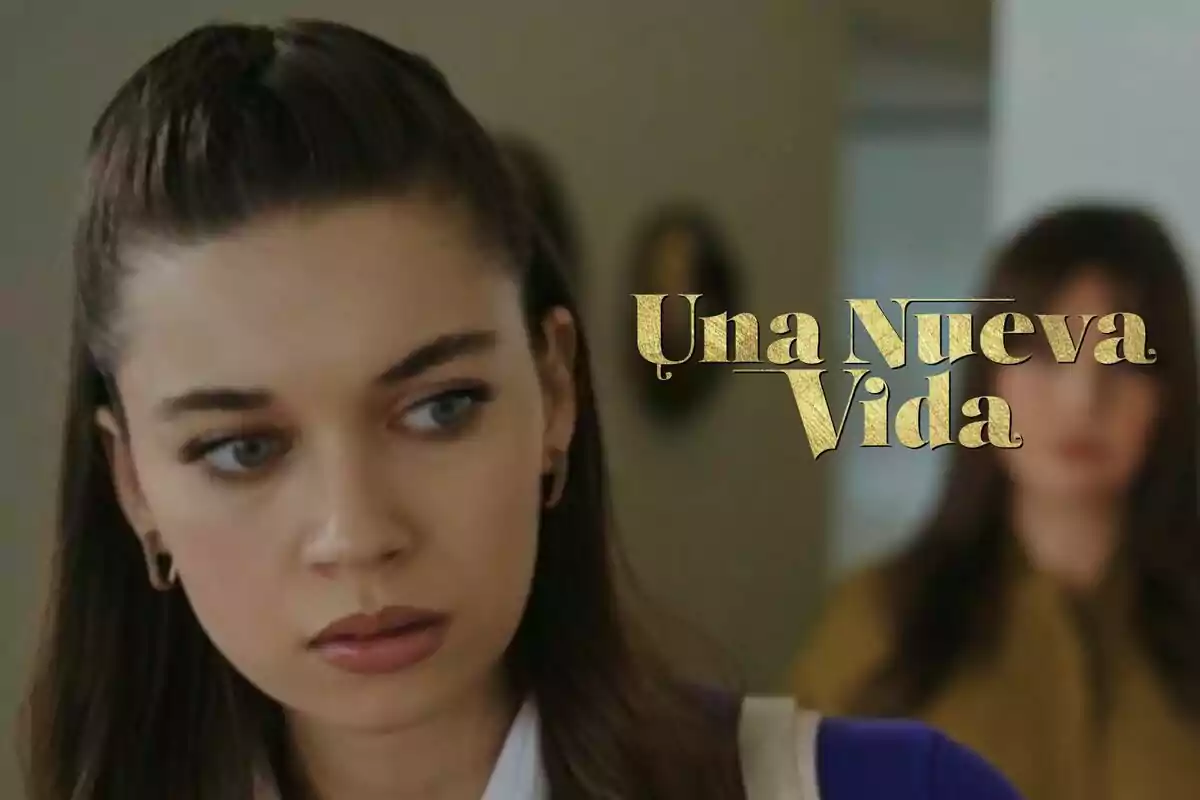 Seyran amb expressió seriosa i el text "Una Nova Vida" en lletres daurades.