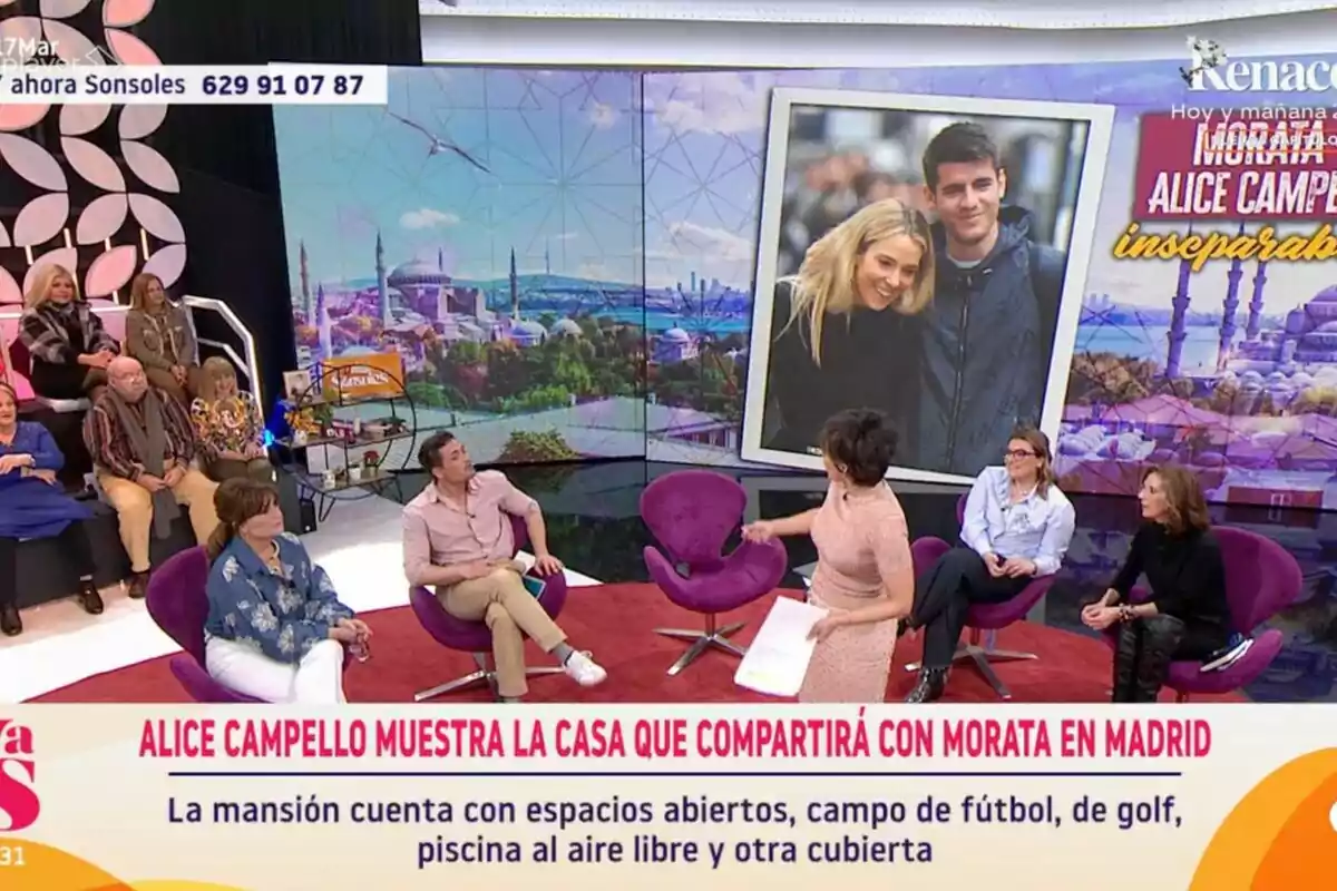 'Y ahora Sonsoles' con varias personas sentadas en un set, una pantalla grande muestra una imagen de una pareja y un texto sobre una casa en Madrid. 'Y ahora Sonsoles' con varias personas sentadas en un set, una pantalla grande muestra una imagen de una pareja y un texto sobre una casa en Madrid.